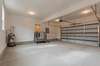 2 car insulated garage with concrete floor. Gate opens on the banister for easy grocery unloading so you don't have to carry them up the stairs.