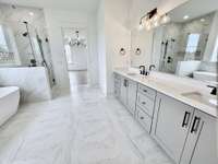 Level 3 Quartz or Granite Counter-Tops in Primary Bath with Rectangle Undermount Sinks.