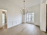 Formal Dining with Wainscot & Beautiful Pre-Engineered Hardwood Floors!