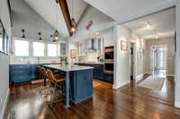 The kitchen ceiling is vaulted and features wood beams