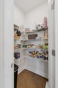 Nestled behind a discreet door is a massive walk-in pantry. Built-in shelving makes organizing all your pantry essentials a breeze! 1772 Tahoma Dr.   Lebanon, TN 37087