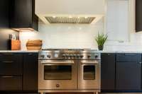 Bertazzoni Full Gas Range with 6 Burners and Electric Griddle. Statement Venetian Plaster Range Hood