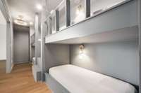 This bunk room is finished off with luxury gold fans and high-end lighting. It is really special, must see!