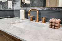 Luxury plumbing fixture and marble on powder room vanity
