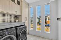 There are two built in dryer racks that make doing laundry truly convenient, and a floor to ceiling broom storage closet.