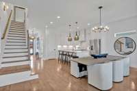 The kitchen flows seamlessly to the dining area.  Plenty of seating here, both at the table and oversized kitchen island:)