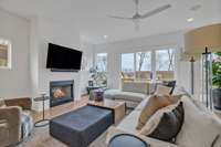 The gas fireplace and surrounding shiplap are a lovely focal point of this living room.