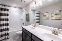 Double vanities in your guest bathroom upstairs. Tiled shower optional.