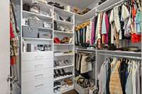 Primary closet by California  closets