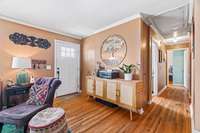 The original hardwoods continue the flow through the hallway to 3 of the 4 bedrooms