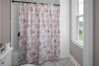Shower & Toilet area is brightened by a lovely window overlooking the lawns outside