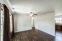 Large great room with lots of natural light. The same flooring continues throughout the entire home. No carpet!