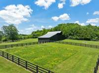 Vegetable/flower garden area is fenced off of the 2nd pasture.