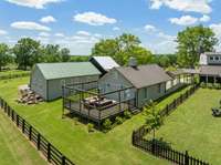 The guest house has its own back porch area that overlooks the north pasture.