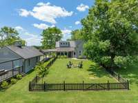 Small pet fenced area to keep your pets safe from roaming off - while you relax by the fire pit.