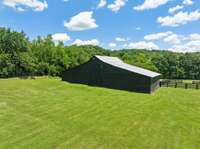 Magnificent, fully reconstructed combo event barn/ stable. There is an incredible event area with an incredible loft area on one side with 2 stables and room for a tractor on the other side of this fantastic barn.