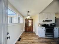 Dinning nook just off the kitchen with access to the back deck and yard