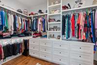 Primary oversized closet with amazing custom drawers and shelving