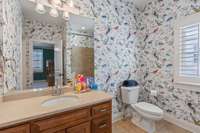 Bathroom 4 with tiled bath and shower.