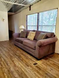 Fresh paint and new flooring in the large living room.