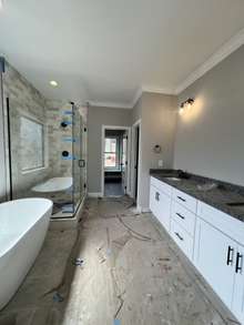 Huge master bath with soaking tub, double vanities, and tile shower