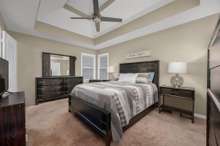 A luxurious primary bedroom featuring plush carpeted floors and trey ceilings! 1327 Christine Dr.   Lebanon, TN 37087