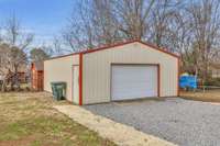 Spacious detached two car garage/shop with separate side entry door.