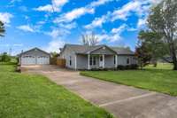 Concrete Driveway leading to home and detached 2 car garage/ shop/ hobby area