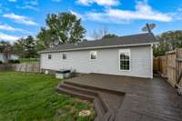 Freshly painted, large wooden deck off the back of house