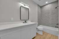 Full bathroom located in the hallway of the 2nd floor. Loads of counter and cabinet space. Tub / shower combo.