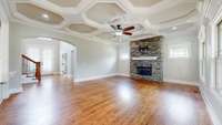 Beautiful coffered ceilings in the open floorplan with natural gas fireplace!