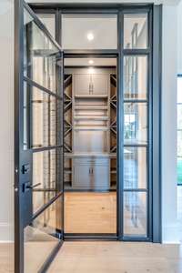 Conditioned Wine Room with custom shelving.