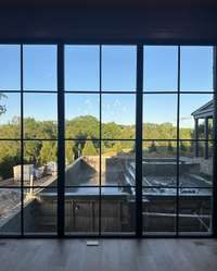 View of Pool and Spa from Primary suite photo taken 5/10/24