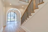 View of Front Staircase off of Foyer and Spacious Vestibule