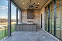 View of Covered Outdoor Dining area with Grilling station and Bar seating