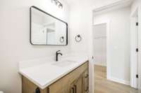 bath 2 has custom vanity and quartz countertop