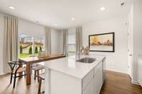 Photos of our Aspen model home shown - kitchen island with single bowl sink