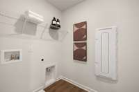 Photos of our Aspen model home shown - walk-in laundry room on the second story along with the bedrooms