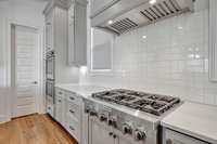 A gas cooktop, ample counter space, and double ovens make day-to-day cooking, as well as entertaining, a breeze