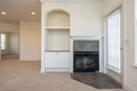 Fireplace and door to covered balcony