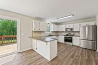 Kitchen with Granite Countertops and Backsplash