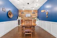 Dining room with accent wood wall