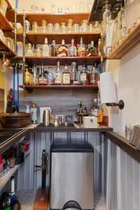 Closet converted to a wet bar with sink