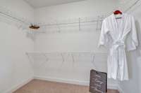 The walk-in closet within the owner's bath suite provides ample space to organize and display your wardrobe essentials.
