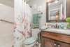 Master bath with Granite top and same cabinet style as kitchen.