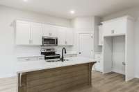 beautiful custom cabinetry with large pantry