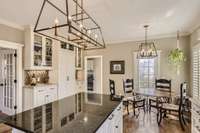 This spacious kitchen also has a bright breakfast area, a wet bar and a coffee bar nook as well