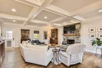 Enjoy this over-sized great room with a coffered ceiling and new digital sound system