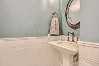 The powder room with designer touches - a perfect fit for this wonderful home