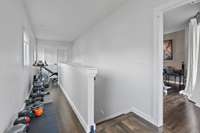 This small hallway has been perfect for these homeowners to use as a workout space.